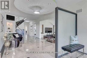 Toronto (Agincourt South-Malvern West) apartment for rent - A living room with a black couch and a glass door.
