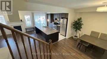 Cambridge townhouse for rent - A well-lit kitchen with a dining table and chairs.