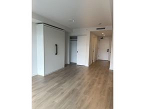Surrey apartment for rent - A room with a white cabinet and a wooden floor.