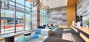 Toronto (Moss Park) condo for rent - A reception area with a sign that says "Right at Home Realty, Brokerage".