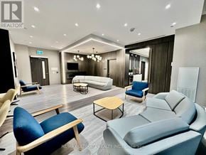 Toronto (Islington-City Centre West) condo for rent - A living room with a grey sofa and blue chairs.