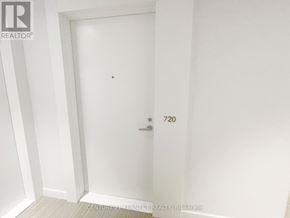 Toronto (Kensington-Chinatown) condo for rent - A white door with the number 720 on it.