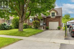 London East (East H) apartment for rent - A house with a tree in front of it.