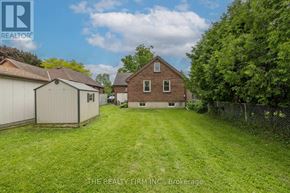 London East (East H) apartment for rent - A backyard with a shed and a house.