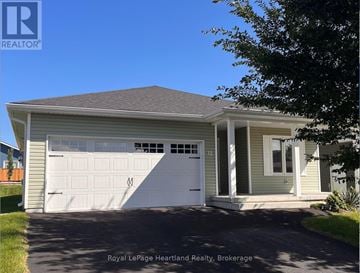 Goderich (Goderich (Town)) apartment for rent - A house with a white garage door is for sale.