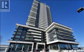 Pickering (Bay Ridges) condo for rent - A tall, modern building with a curved design and multiple windows.