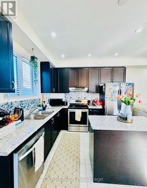 Brant (Paris) townhouse for rent - A kitchen with black cabinets and a patterned tile floor.