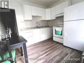 Toronto (Corso Italia-Davenport) apartment for rent - A kitchen with white appliances and wooden flooring.