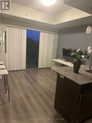Waterloo condo for rent - A kitchen with a counter and a sink.