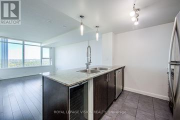 Toronto (Bendale) condo for rent - A kitchen with a sink and cabinets is shown in this image.