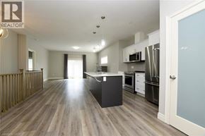 Simcoe townhouse for rent - A modern kitchen with wooden floors and a large island.