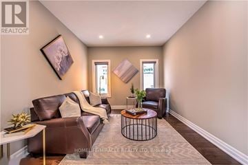 London North (North S) apartment for rent - A living room with a brown leather couch and a coffee table.