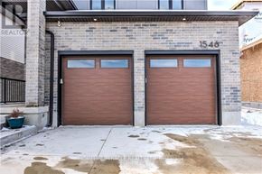 London North (North S) apartment for rent - A building with the number 1548 on it has two garage doors.