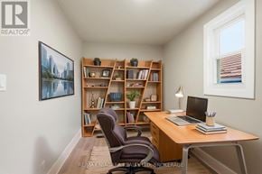 Hamilton (Mcquesten) apartment for rent - A room with a desk, chair, and bookshelf.
