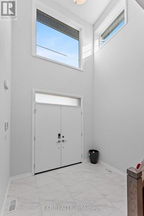 Pelham (Fonthill) apartment for rent - A white room with a door and a window.