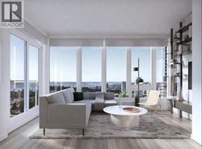 Coquitlam apartment for rent - A modern living room with a grey sofa and a coffee table.
