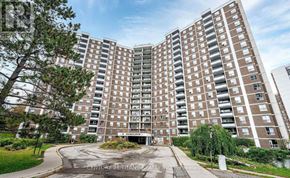 Toronto (Flemingdon Park) condo for rent - A large, multi-story residential building with a central courtyard.