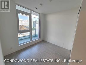 Vaughan (Vaughan Corporate Centre) condo for rent - A room with a large window overlooking a cityscape is for sale by Condowong Real Estate Inc.