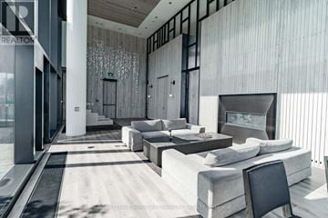Toronto (Church-Yonge Corridor) condo for rent - A modern living room with a large couch and a television.