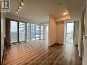 Vaughan (Vaughan Corporate Centre) condo for rent - A spacious room with wood flooring and large windows.