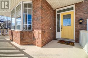 Milton (Be Beaty) apartment for rent - A house with a yellow door and a sign that says REALTOR.