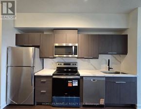 Toronto (Glenfield-Jane Heights) condo for rent - A kitchen with a refrigerator, stove, and microwave.