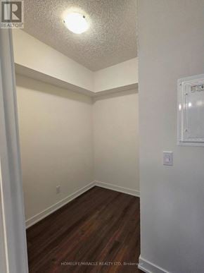 Toronto (Glenfield-Jane Heights) condo for rent - A room with wooden flooring and white walls.