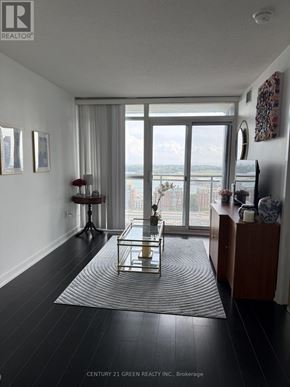 Toronto (Waterfront Communities) condo for rent - A living room with a view of the water.