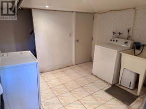 Toronto (Dovercourt-Wallace Emerson-Junction) triplex for rent - A laundry room with a washer and dryer.