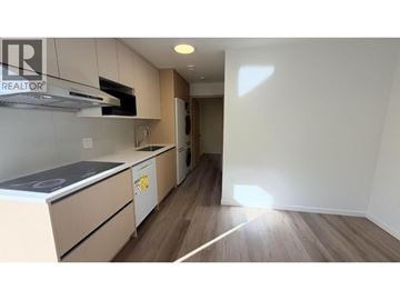 Vancouver apartment for rent - A kitchen with a stove top oven and a microwave.