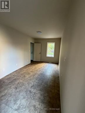 Toronto (Oakwood Village) apartment for rent - A room with a tiled floor and a window letting in light.