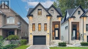 Mississauga (Port Credit) apartment for rent - A house with a garage is shown in front of a sign that says "REALTOR".