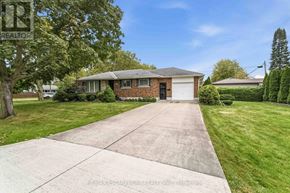 St. Catharines (Bunting/Linwell) apartment for rent - A house with a driveway in front of it.