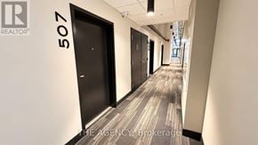 Guelph (St. Patrick's Ward) condo for rent - A hallway with a door numbered 507 and a logo that says REALTOR.
