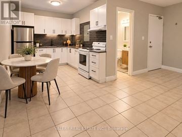 Toronto (Ionview) condo for rent - A kitchen with a table and chairs in it.