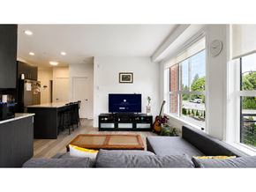 Langley apartment for rent - A modern living room with a grey sofa and a wooden coffee table.