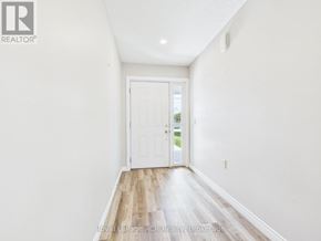 Morris Turnberry (Turnberry) townhouse for rent - A white hallway with a door and wooden floors.