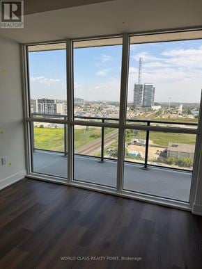 Milton (Om Old Milton) condo for rent - A room with a view of a highway and buildings outside.