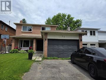 Barrie (Allandale) apartment for rent - A black car is parked in front of a house with a garage.