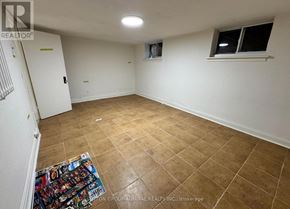 Toronto (Briar Hill-Belgravia) apartment for rent - A room with a tiled floor and a window with a white frame.