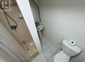 Toronto (Briar Hill-Belgravia) apartment for rent - A white toilet with a roll of toilet paper on it.