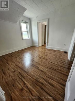 Melancthon apartment for rent - A room with wooden flooring and white walls.