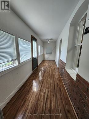 Melancthon apartment for rent - A long hallway with wooden floors and white walls.