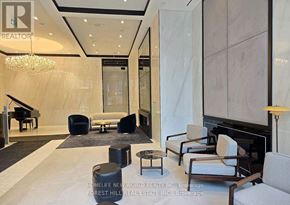 Toronto (Bay Street Corridor) condo for rent - A living room with a piano and a chandelier.