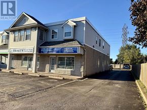 Niagara Falls (Stamford) apartment for rent - A building with a blue sign that says "Trinity" is in the background.