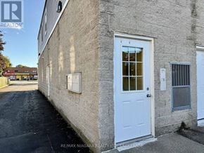 Niagara Falls (Stamford) apartment for rent - A building with a white door and windows is shown.