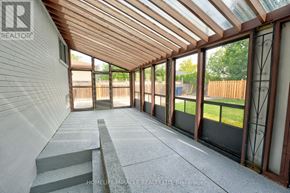 Toronto (Mount Olive-Silverstone-Jamestown) apartment for rent - A sunroom with a glass roof and a concrete floor.