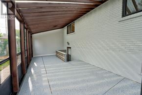 Toronto (Mount Olive-Silverstone-Jamestown) apartment for rent - A patio area with a wooden roof and a bench.