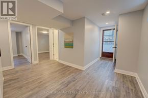 Toronto (Mount Olive-Silverstone-Jamestown) apartment for rent - A spacious room with wooden flooring and white walls.