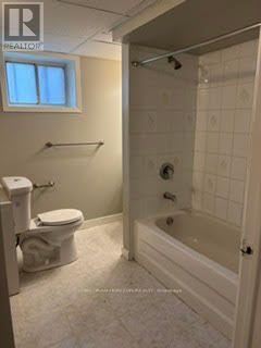 Toronto (West Humber-Clairville) apartment for rent - A white bathroom with a toilet, sink, and bathtub.